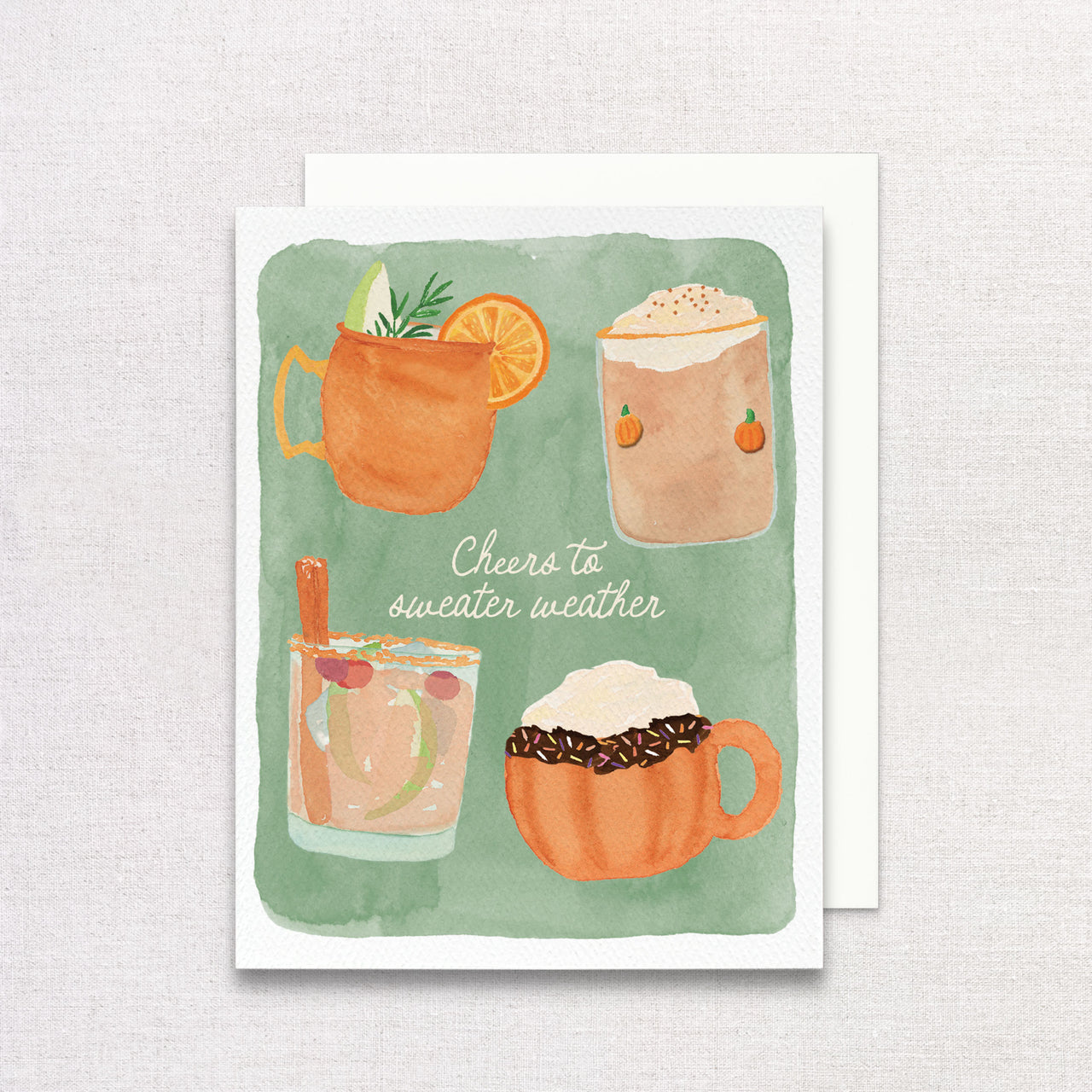 Greeting card with illustrations of drinks and text 'Cheers to sweater weather' on a green background.