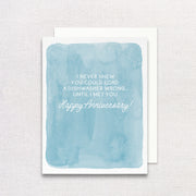 Blue watercolor card with white text