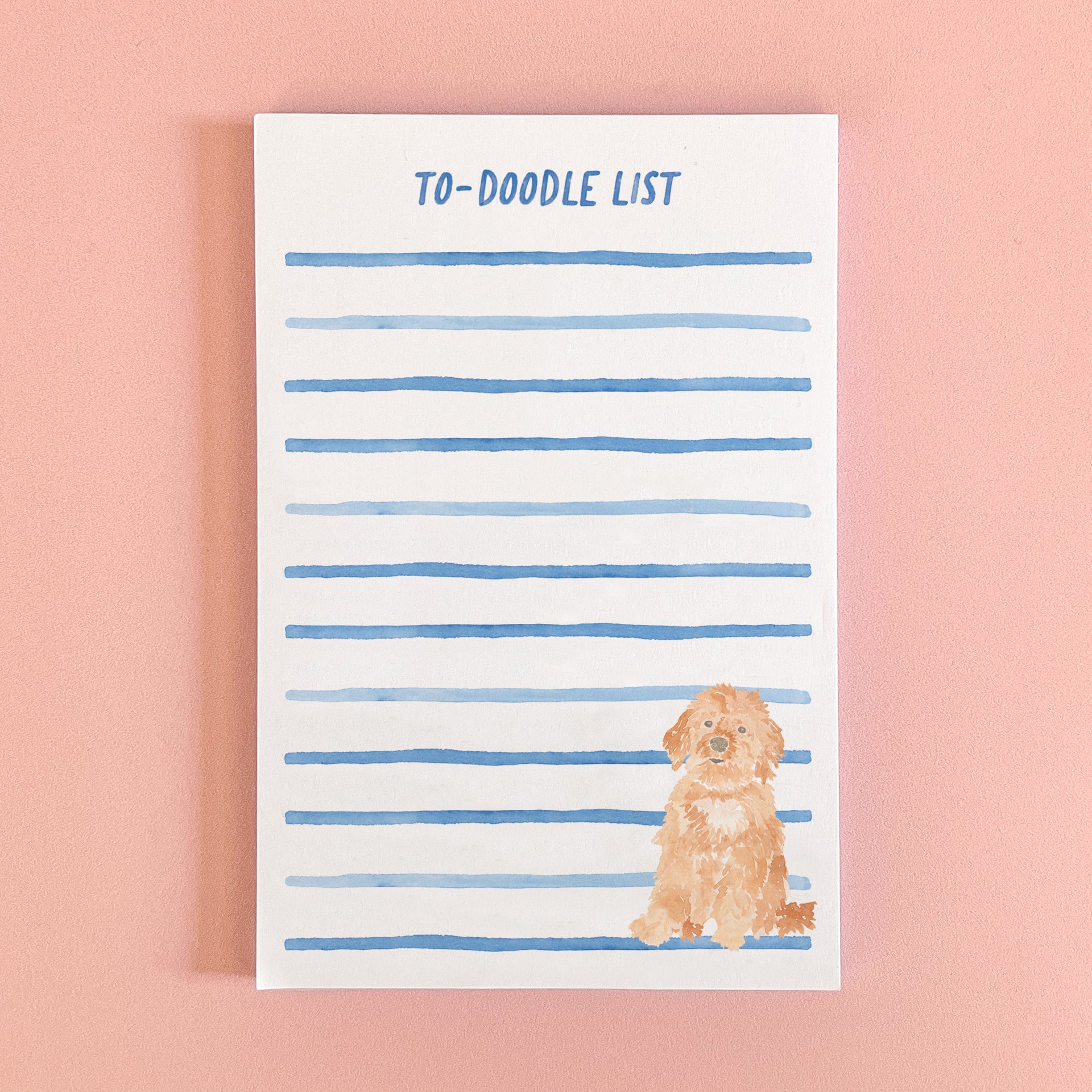 Notepad with a watercolor painted goldendoodle and the phrase to-doodle list