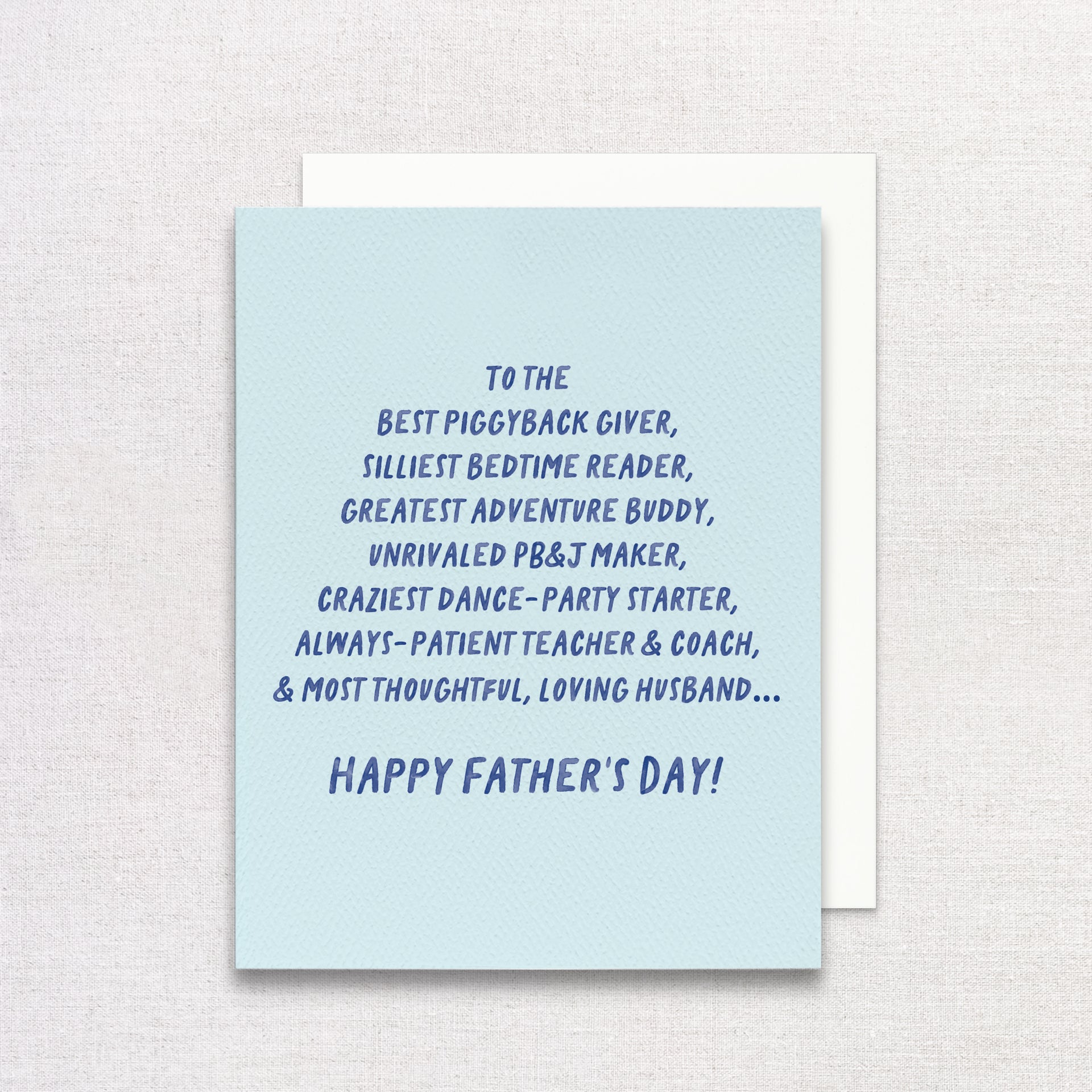 Father's Day card for husband with blue text on a light blue background