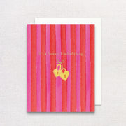 Greeting card with red and pink striped design and gold heart lock illustration on a textured background.