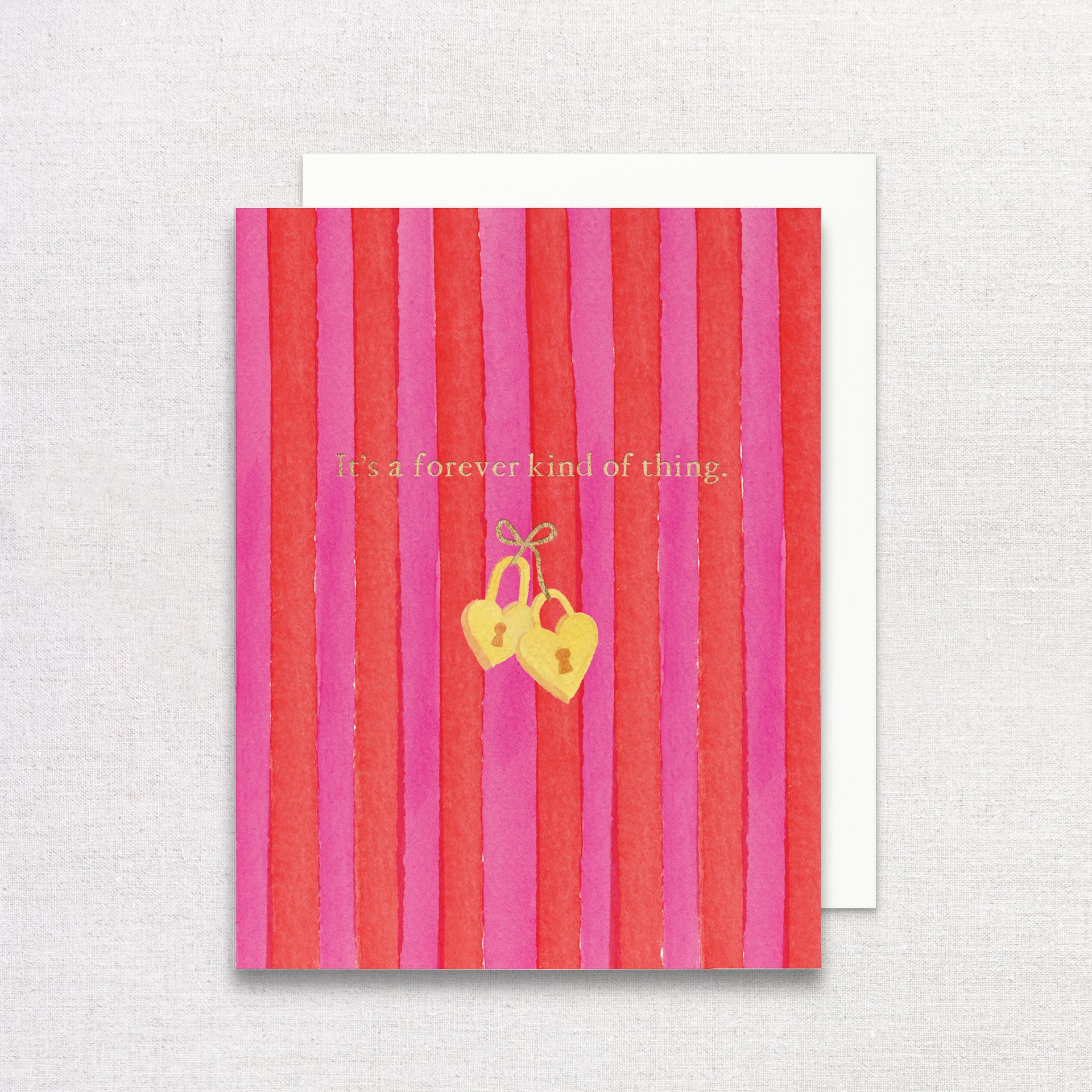 Greeting card with red and pink striped design and gold heart lock illustration on a textured background.