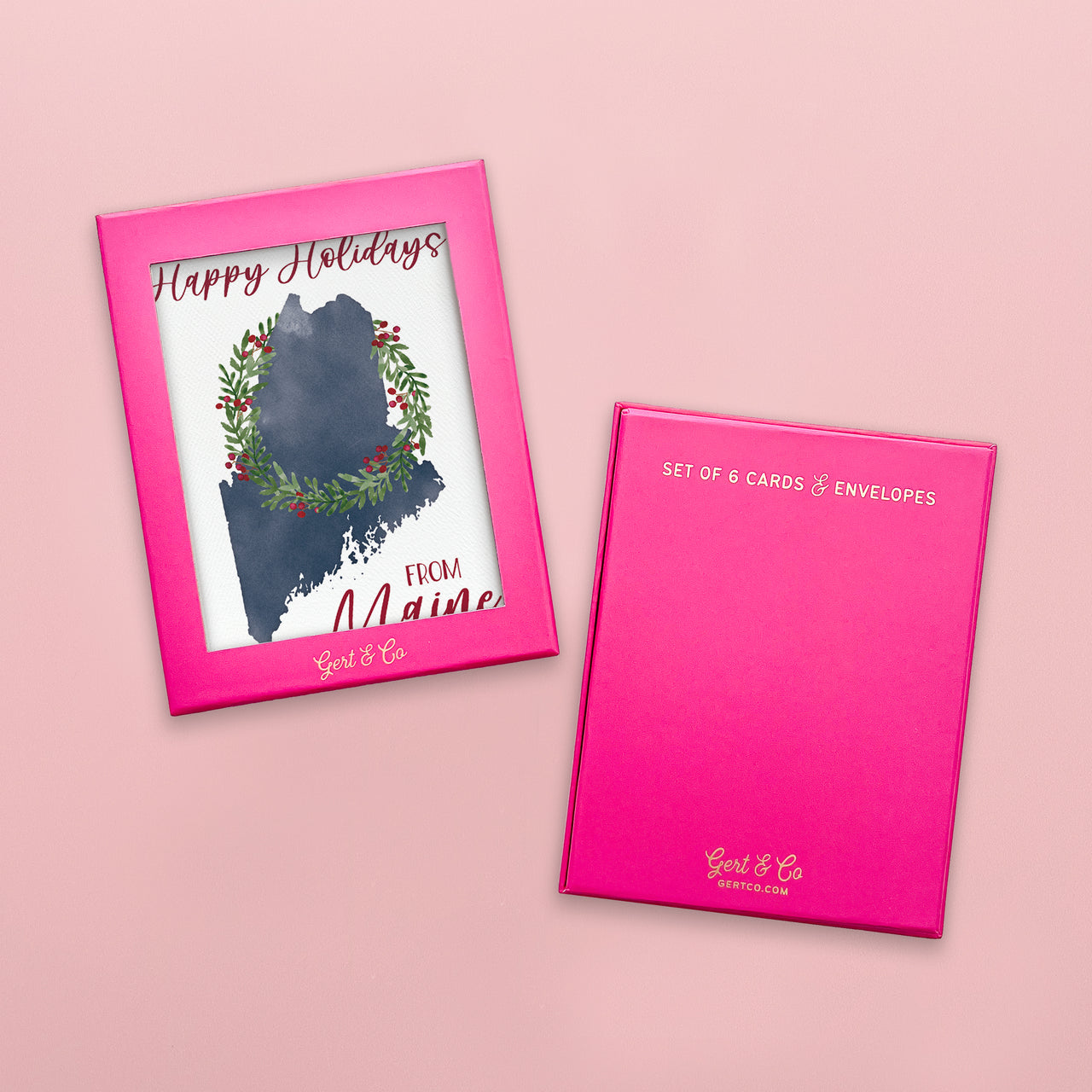 Set of 6 Maine holiday greeting cards with pink packaging on a pink background