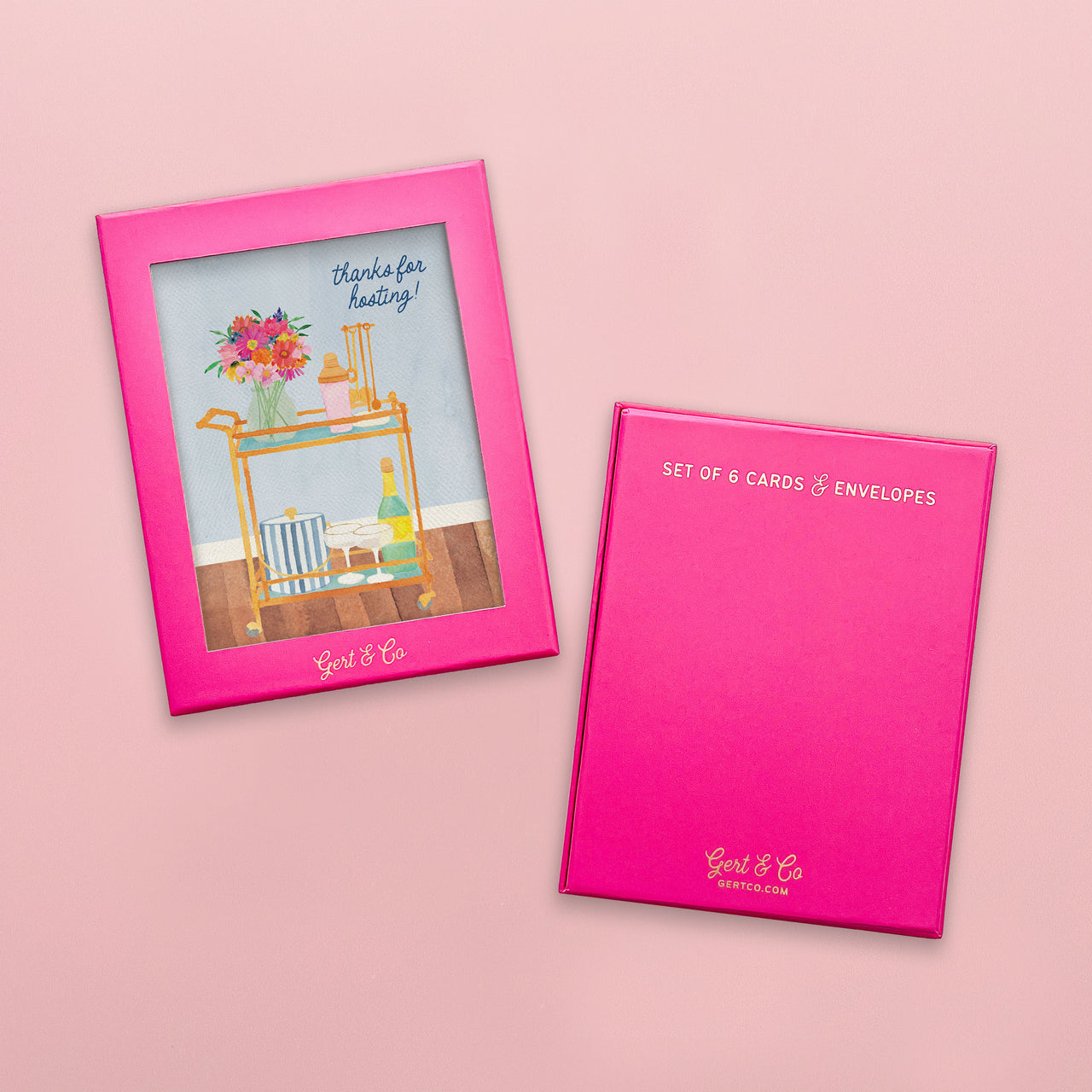Pink card holder with a card featuring a bar cart and phrase thanks for hosting