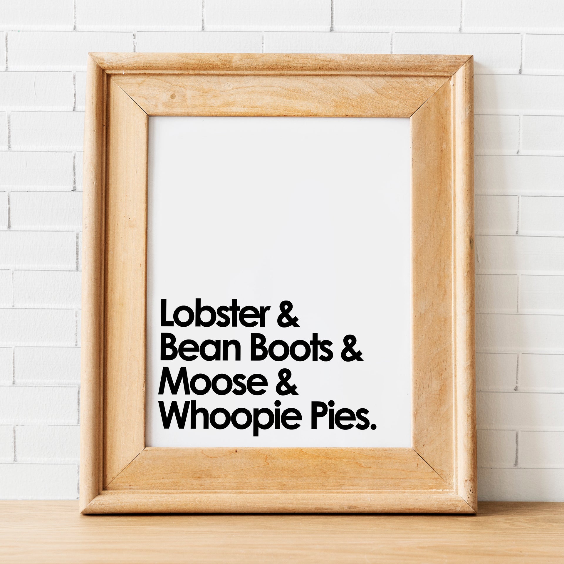 Maine Lobster & Bean Boots Print Framed Against Brick Wall by Gert & Co